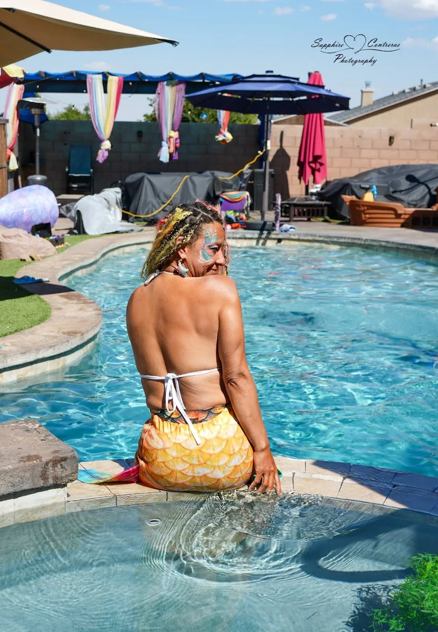 Miss Selenia relaxing at the edge of the pool